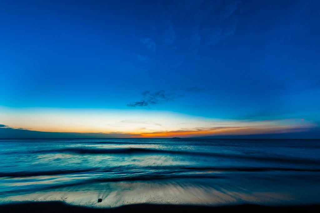 时间流逝在日落的高清壁纸海边的照片