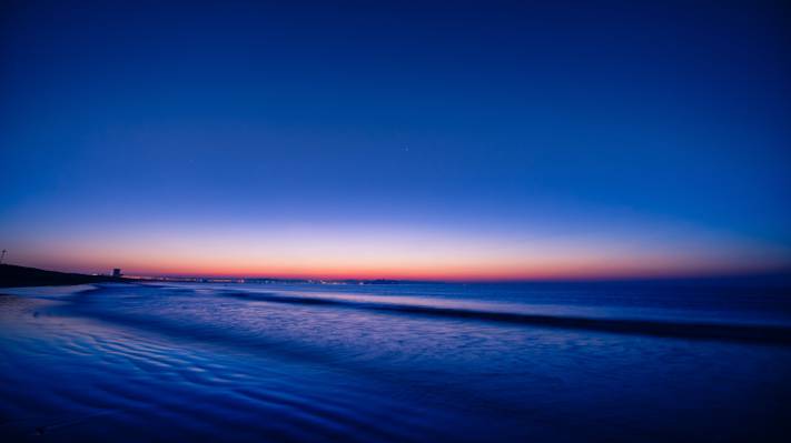 日落期间蓝色大海的风景照片高清壁纸